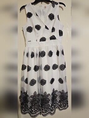 Xian Xian Sleeveless White Midi Dress with Black Floral Embroidery, size Medium.